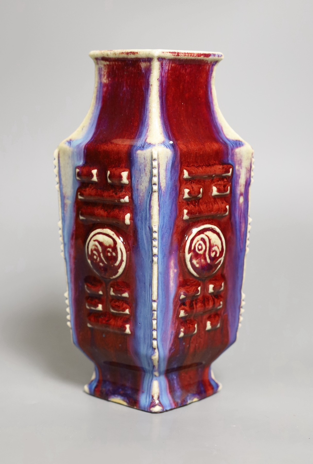 A Chinese flambe ‘eight trigrams’ lozenge section vase, late 19th / early 20th century, 22cm tall